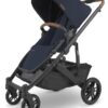 UPPAbaby Cruz V2 Stroller Full-Featured Stroller With Travel System Capabilities Toddler Seat, Bumper Bar, Bug Shield, Rain Shield Included Noa (Navy Carbon Frame Saddle Leather)